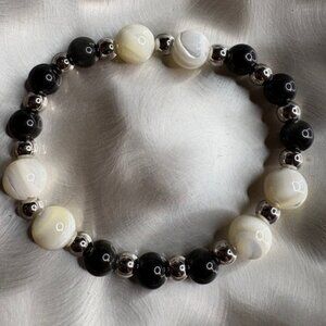 This combination symbolizes harmony—balancing strength and serenity.